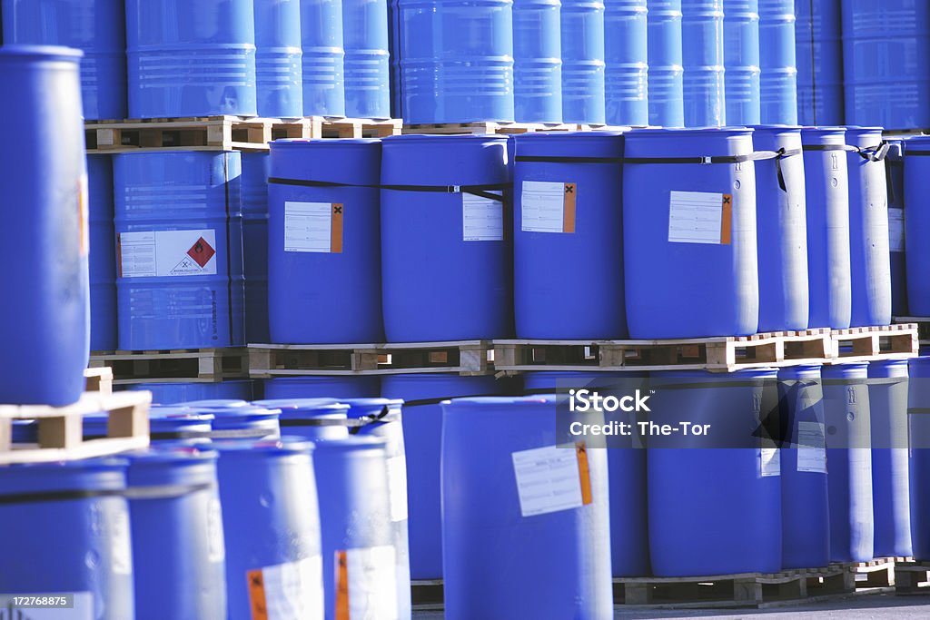 Toxic Waste A pile with blue barrels. Chemical Stock Photo