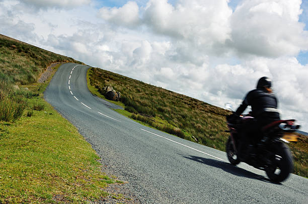 istock Speeding motorcycle on a winding country road 172768984