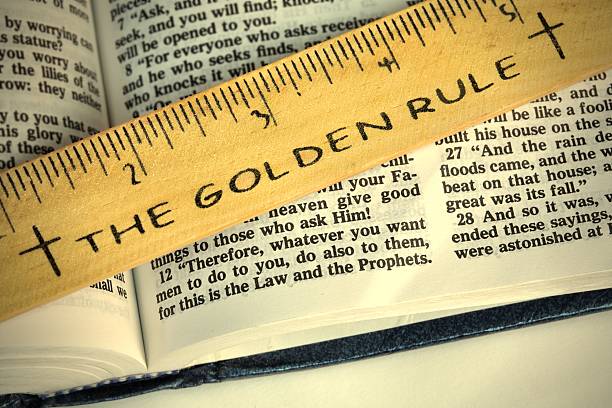 Religious: The Golden Rule on open Bible horizontal stock photo
