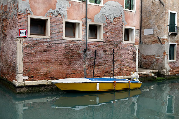 istock Boat on Quiet Canal Venice Italy 172770922