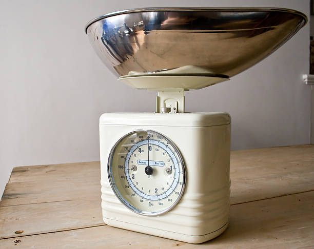 istock Retro cream scales on a rustic wooden table. 172770998