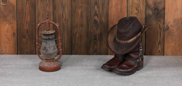 cowboy hat and boots on wooden floor