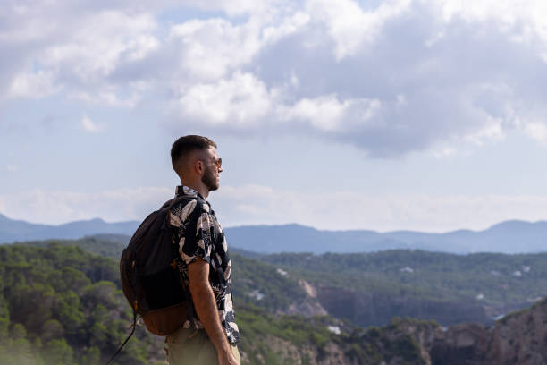 istock Caucasian man looking at the view from the mountain 1727713276