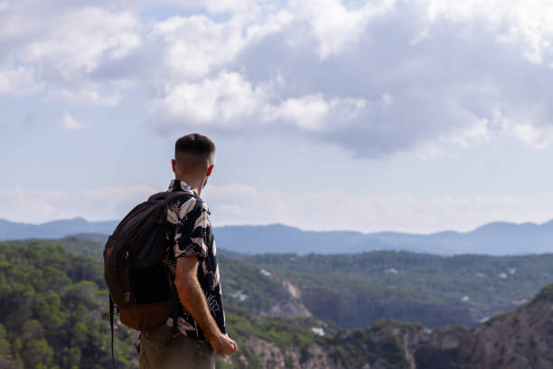 istock Man looking at the view from the mountain 1727713279