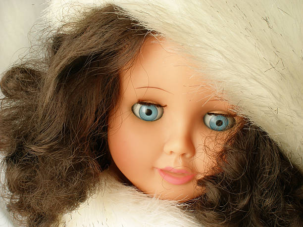 istock Cover doll wearing a  white fur hat 172773093
