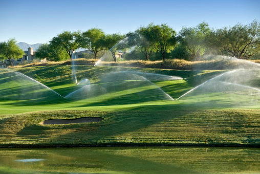 Sprinklers Watering a Scottsdale Golf Course in the Early Morning...