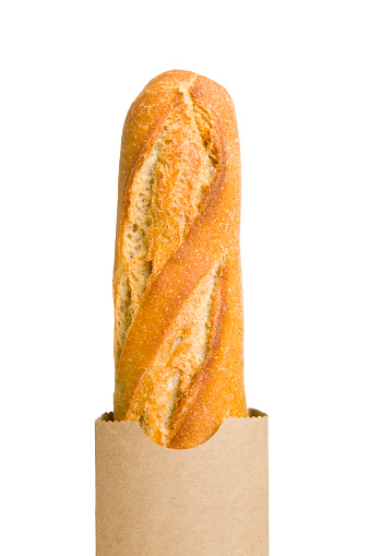 A fresh baguette in a paper bag. Isolated against a pure white background.