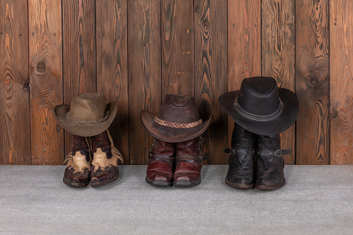 cowboy hat and boots on wooden floor