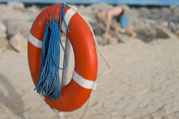 istock Life ring and child on a beach 172774557