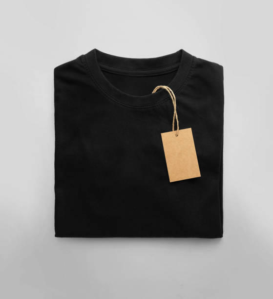istock Black folded t-shirt with price tag label. 1727746684
