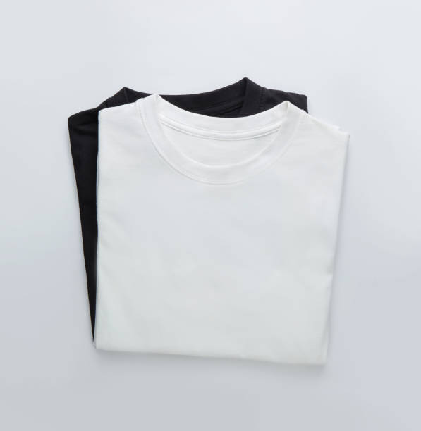 istock White and black folded t-shirt on white background 1727748347
