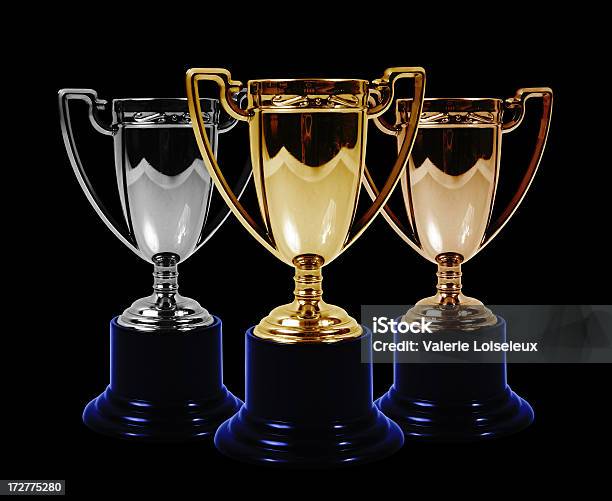 Oro Plata Y Bronce Trofeos Foto de stock y más banco de imágenes de Podio del ganador - Podio del ganador, Deporte, Tres objetos