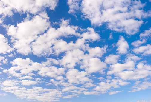 Super high-resolution blue sky panorama with fluffy white clouds.
