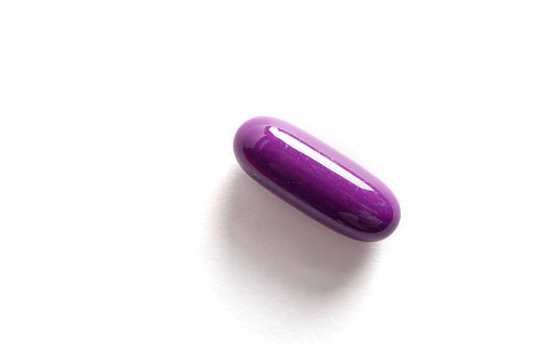 Purple pill stock photo