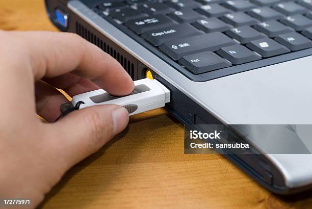 Inserting Pen Drive Stock Photo - Download Image Now - USB Stick, Inserting, Activity