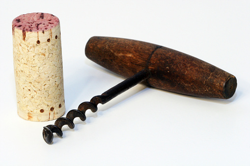 Old corkscrew and cork