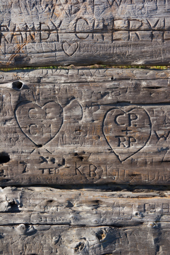 Detail photograph of carved initials.Similar image: