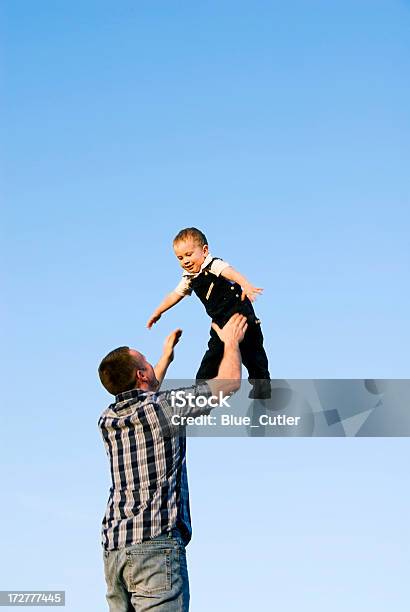 Joys Of Parenthood Stock Photo - Download Image Now - Father, Picking Up, Baby - Human Age