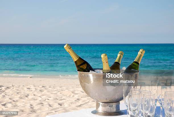 Champagne For A Celebration On The Beach Stock Photo - Download Image Now - Beach, Champagne, Bottle