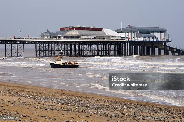 Fishing Boat In The Surf At Cromer Stock Photo - Download Image Now - Cromer, England, Barren