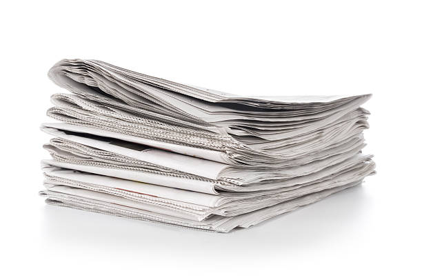giornali quotidiani - close up newspaper folded document foto e immagini stock