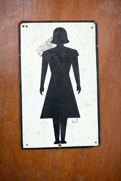 antique woman's toilet icon symbol on washroom door stock photo