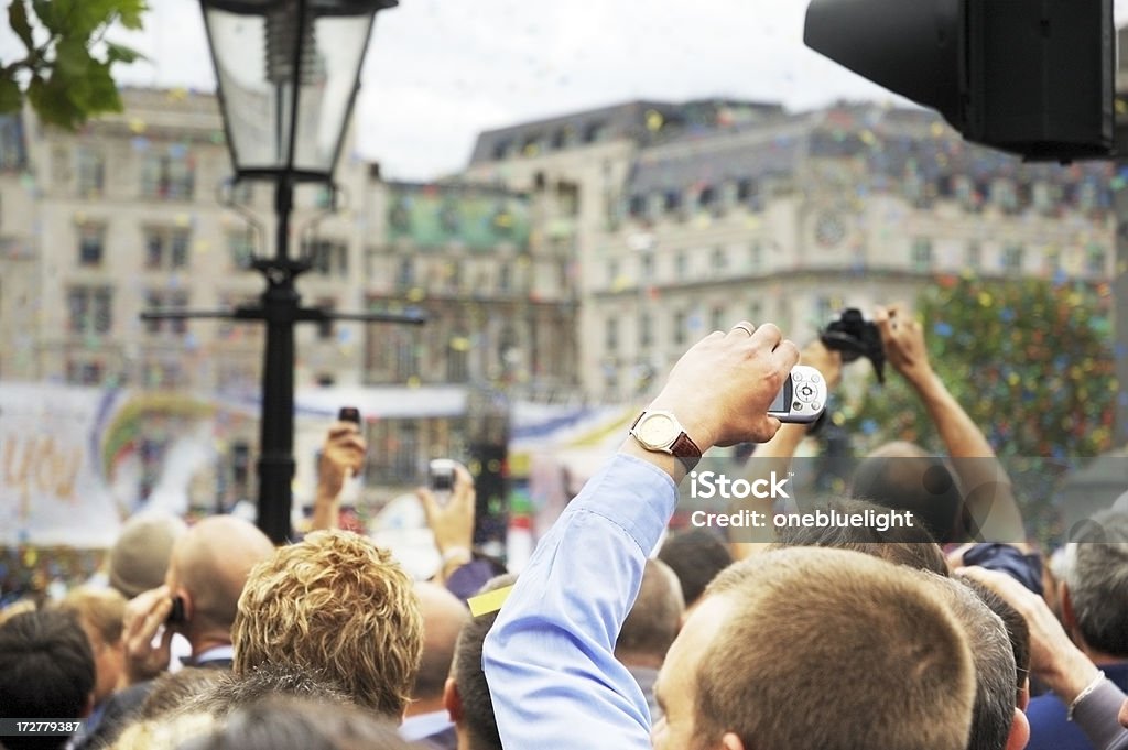 Crowd Londoners are celebrating the announcement that London will host the 2012 Olympics games Holding Stock Photo