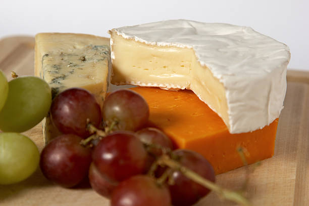 istock Blue stilton camembert red leicester cheeses and grapes 172779897