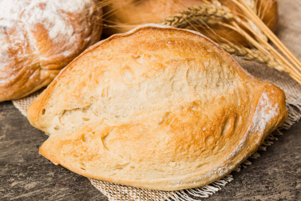 istock Homemade natural breads. Different kinds of fresh bread as background, perspective view with copy space 1727809188