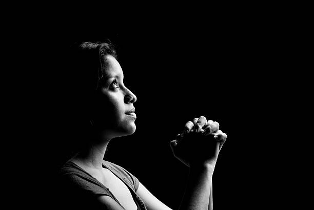 istock Teenager prays fervently 172781528