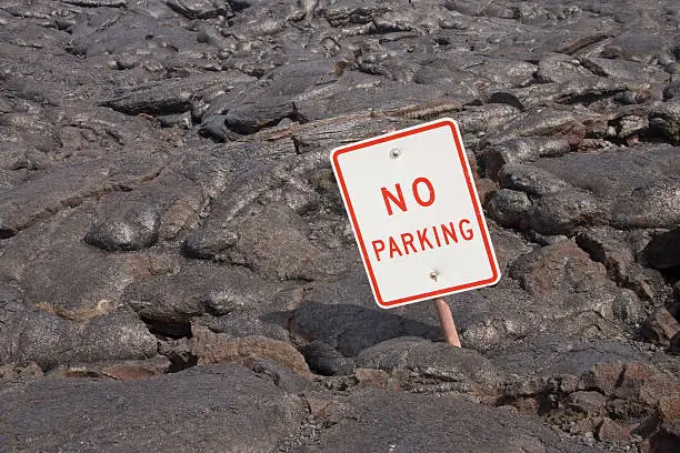No Parking sign sticks out of lava flow.