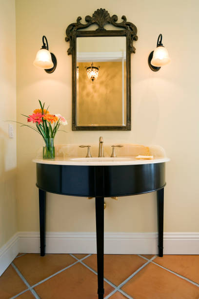 Powder Room Beautiful vanity & mirror in this estate home. powder room stock pictures, royalty-free photos & images