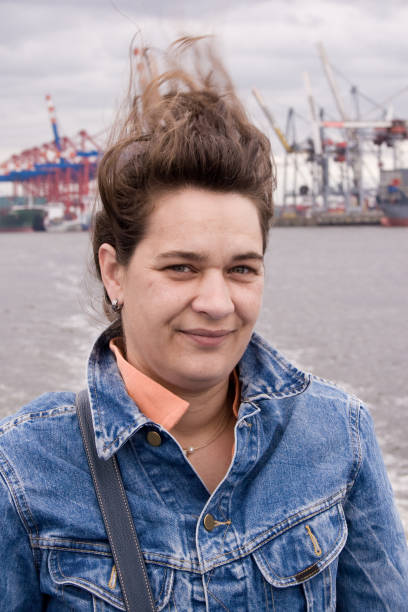 Woman with wind blown hair on a boat tour in Hamburg.See my  human being  images :