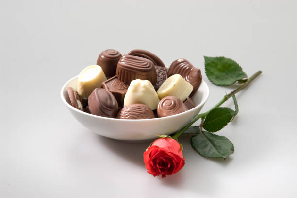 istock variety of chocolates with red rose 172782309