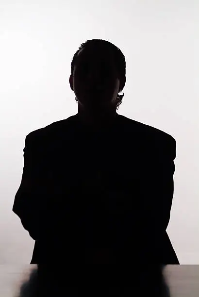 A silhouette of a mystery man.