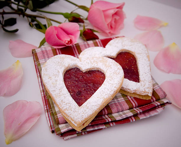 Baked Gift of Valentine's Heart Shaped Cookies "Homemade jam filled heart cookies, a sweet gift to a loved one. (SEE LIGHTBOXES BELOW for similar photos, as well as many more holiday, baking, food and cooking photos...)" rose christmas red white stock pictures, royalty-free photos & images