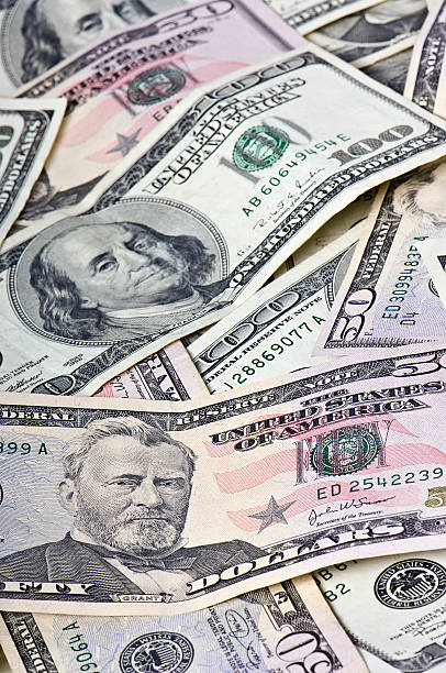 istock Pile of 50 & 100 Dollar Bills #1 172782984