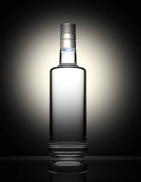 istock Clear vodka bottle isolated on black and gray background 172783055