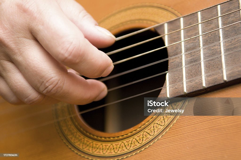 Classical Guitar A woman playing classical guitar. Acoustic Guitar Stock Photo