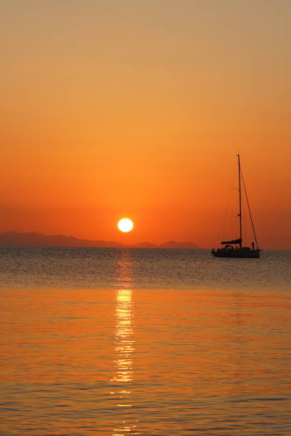 istock Boat at Sunset on the Sea 1727836839