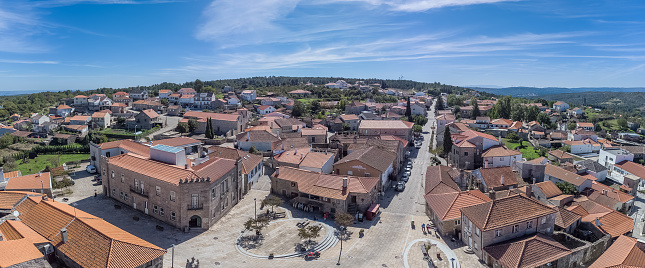 Penedono Viseu Portugal - 09 24 2023: Panoramic aerial exterior view at the 25 Abril square, front to the iconic Penedono Castle, on Penedono village downtown, Viseu, Portugal