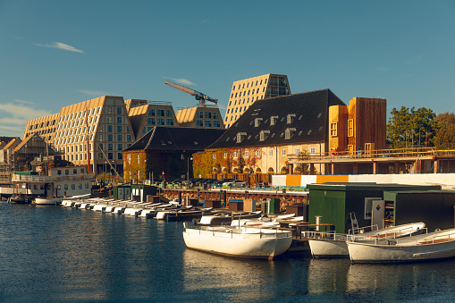 Antique classic construction mixed with new construction in waterfront of canal in Copenhagen