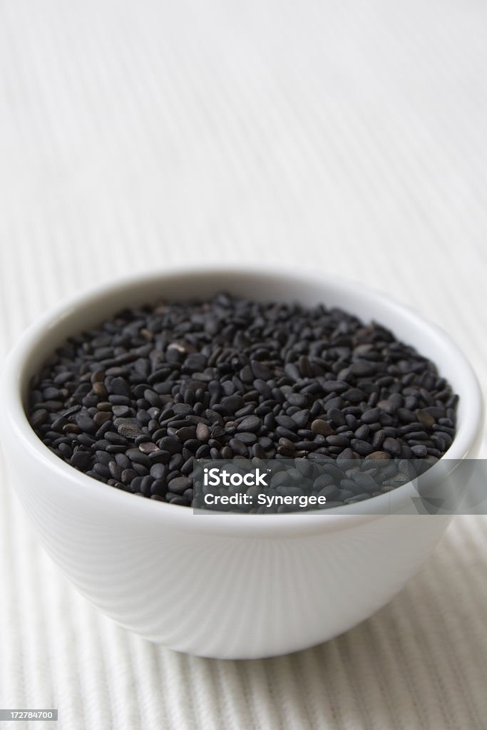 Black sesame seeds Black sesame seeds in a small white bowl. See my porfolio for more... Antioxidant Stock Photo