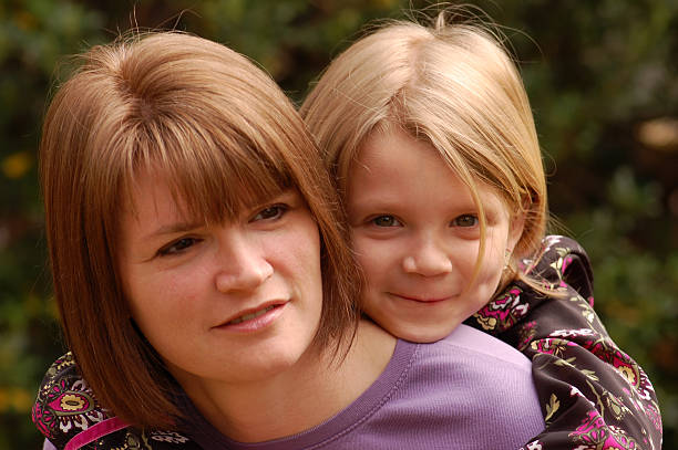 istock Mother and Daughter Piggyback Ride - Eyes Front 172784717