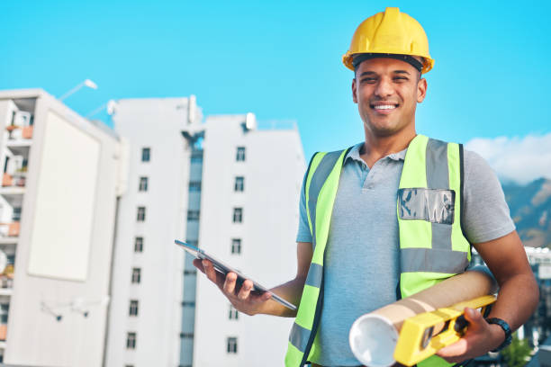 istock Architect equipment, tablet and portrait of happy man, contractor or constructor with construction site floor plan. Civil engineering, city job and engineer smile for architecture project management 1727848738