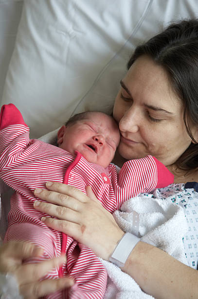 istock Mother holding newborn 172785854