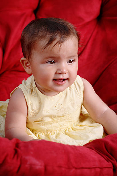 istock Baby girl on couch 172786005