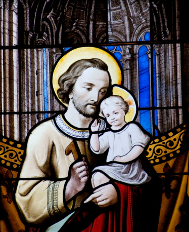 Stained glass window detail from the st. nicolas church in Amsterdam showing Baby Jesus and his father Joseph. Given to the church in 1886 by A.J. Naber and pastor J.H. van Born. Made in France and possibly designed by the then 18 year old Jan Coenraad Bleijs (1868-1952)