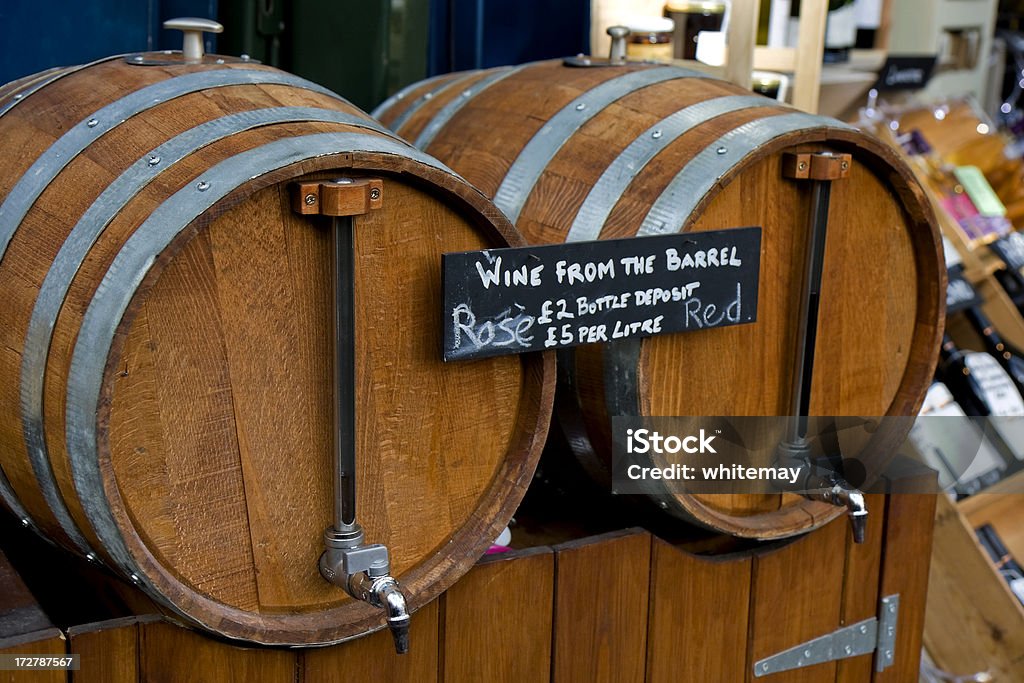 Wine from the barrel Barrels of wine ready for decanting into bottles at an indoor market. Barrel Stock Photo