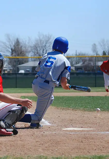 A batter bunts the baseballPlease see some similar pictures from my portfolio: